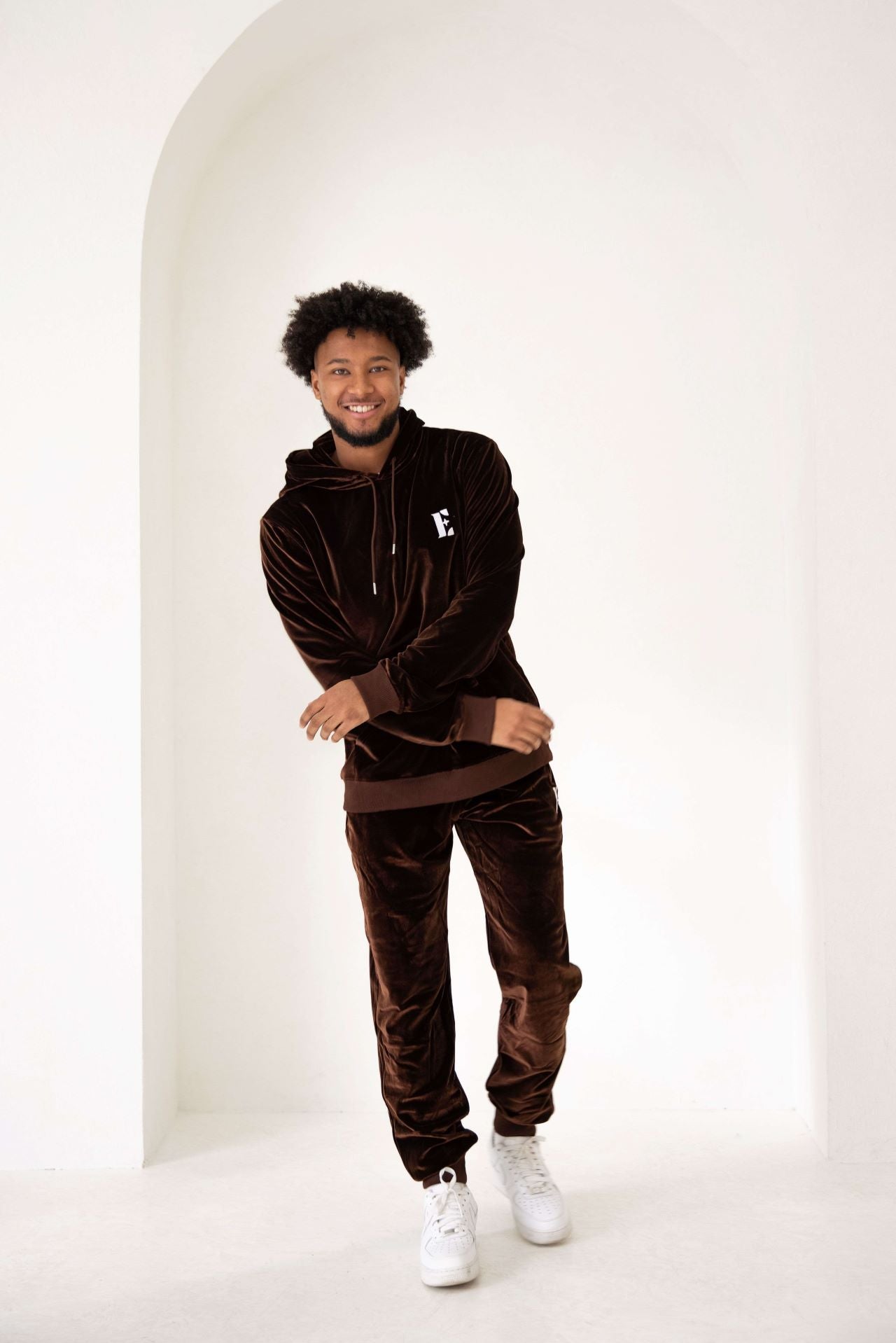 Photo of a male model displaying the full e's element chocolate brown velvet jogger set