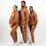 Three models wearing light brown track suits. The tracksuits have the E's Element logo imprinted in white. The models are also wearing white sneakers. E's Element Essential Brown Sugar Sweat suit Set by E's Element.