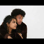 Video of male and female models wearing and posing with the e's element chocolate brown velvet crop top hoodie and jogger set. Also the model are wearing the E's element essential sweatsuit set in light grey.