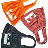 Three of E's Element reusable face masks. The colors are bright orange, light brown, and black. Burnt Orange Face Mask by E's Element.