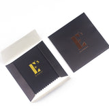 Anti-Tarnishing Polish Cloth placed beside Paper Envelope Packed by E's Element.