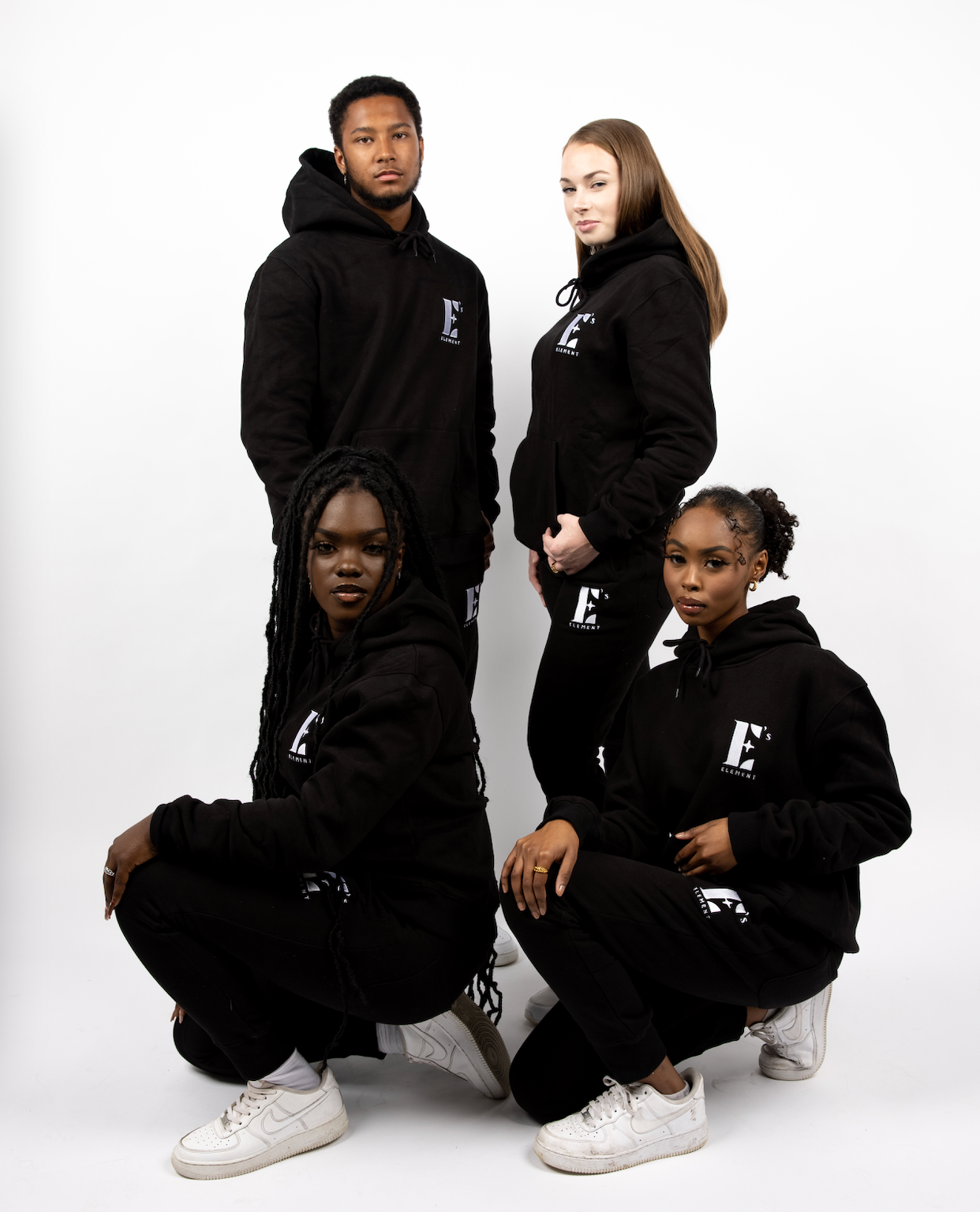 four models wearing E's Element Essential Sweatsuit Set in Black