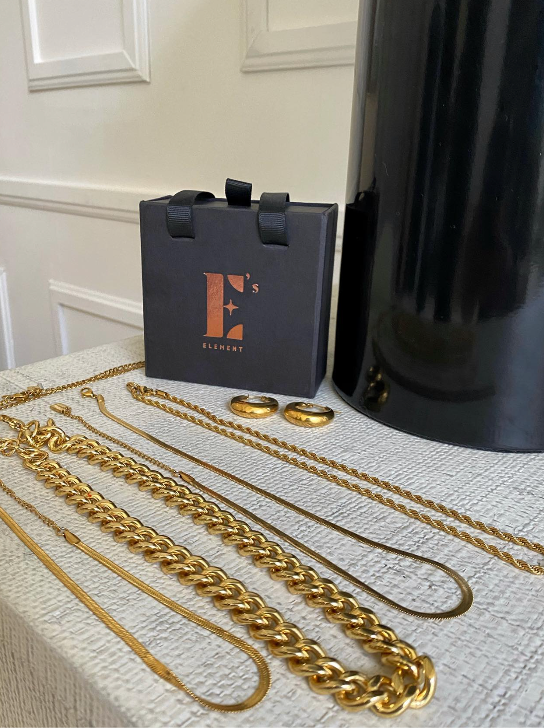E's Element jewlery and branded packaging box on display on a table