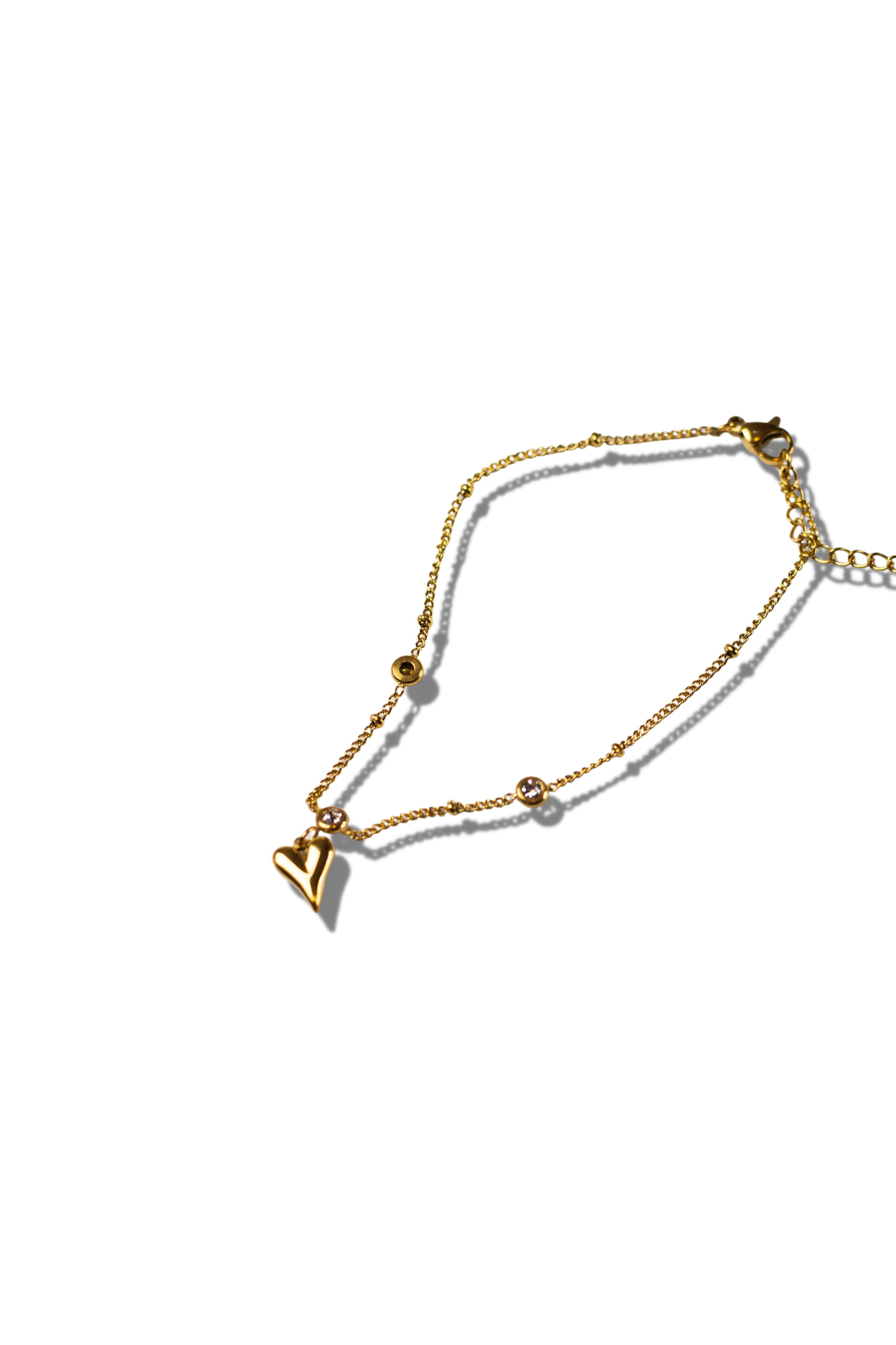 18k gold anklet with a heart shaped charm. Ella's Element Heart Charm Anklet by E's Element.