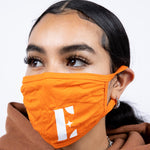 Woman wearing the Burnt Orange Face Mask by E's Element.