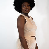 Model wearing beige tank top and shorts. The tank top has E's Element imprinted in white in the middle. Ella Champagne Velvet Set by E's Element.