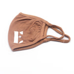 Light brown reusable face mask. The face mask has the E's Element logo imprinted on the bottom left of it. Coffee Face Mask by E's Element.