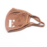 Light brown reusable face mask. The face mask has the E's Element logo imprinted on the bottom left of it. Coffee Face Mask by E's Element.