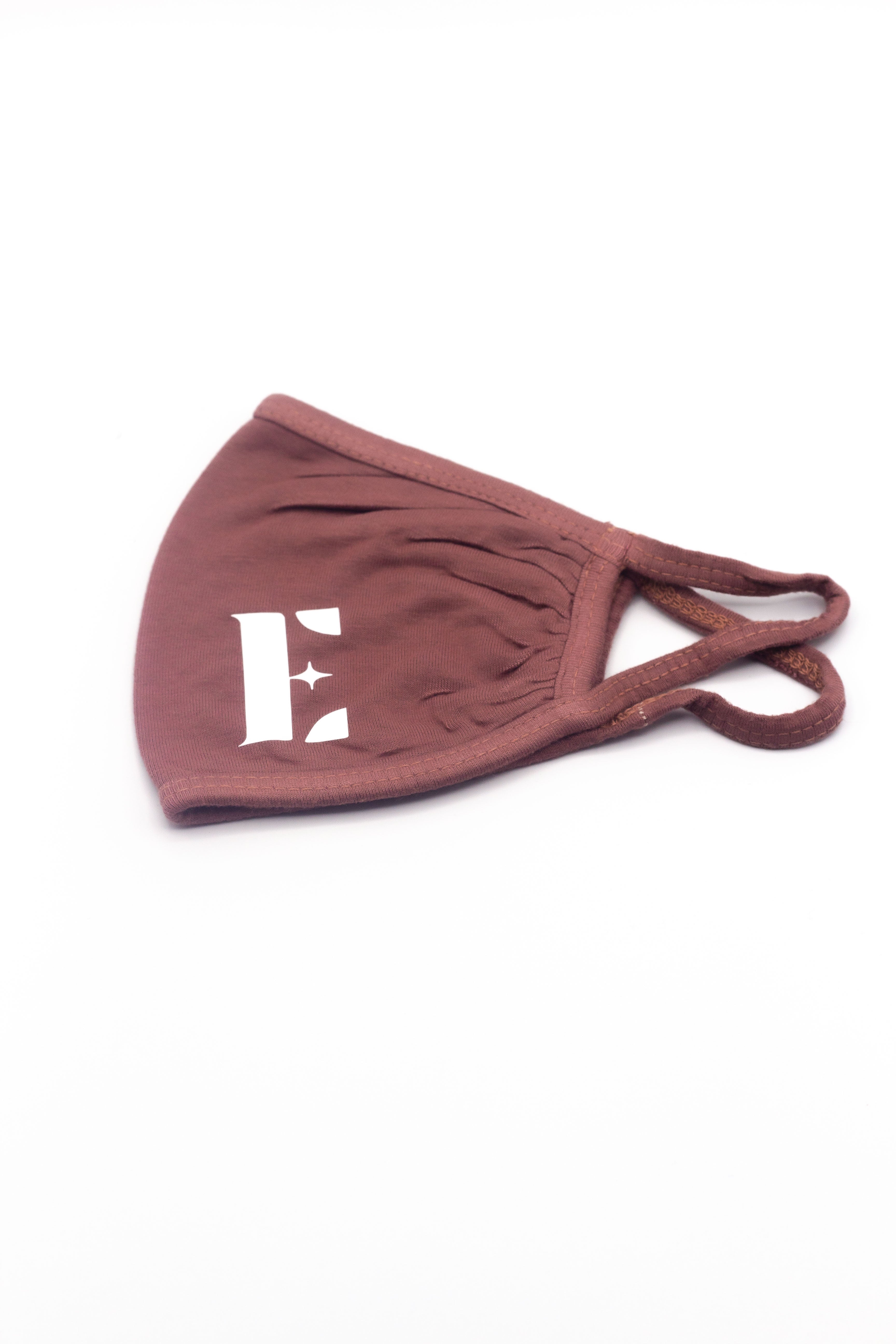 Pink face mask with the E's Element logo in white. Mauve Pink Face Mask by E's Element.