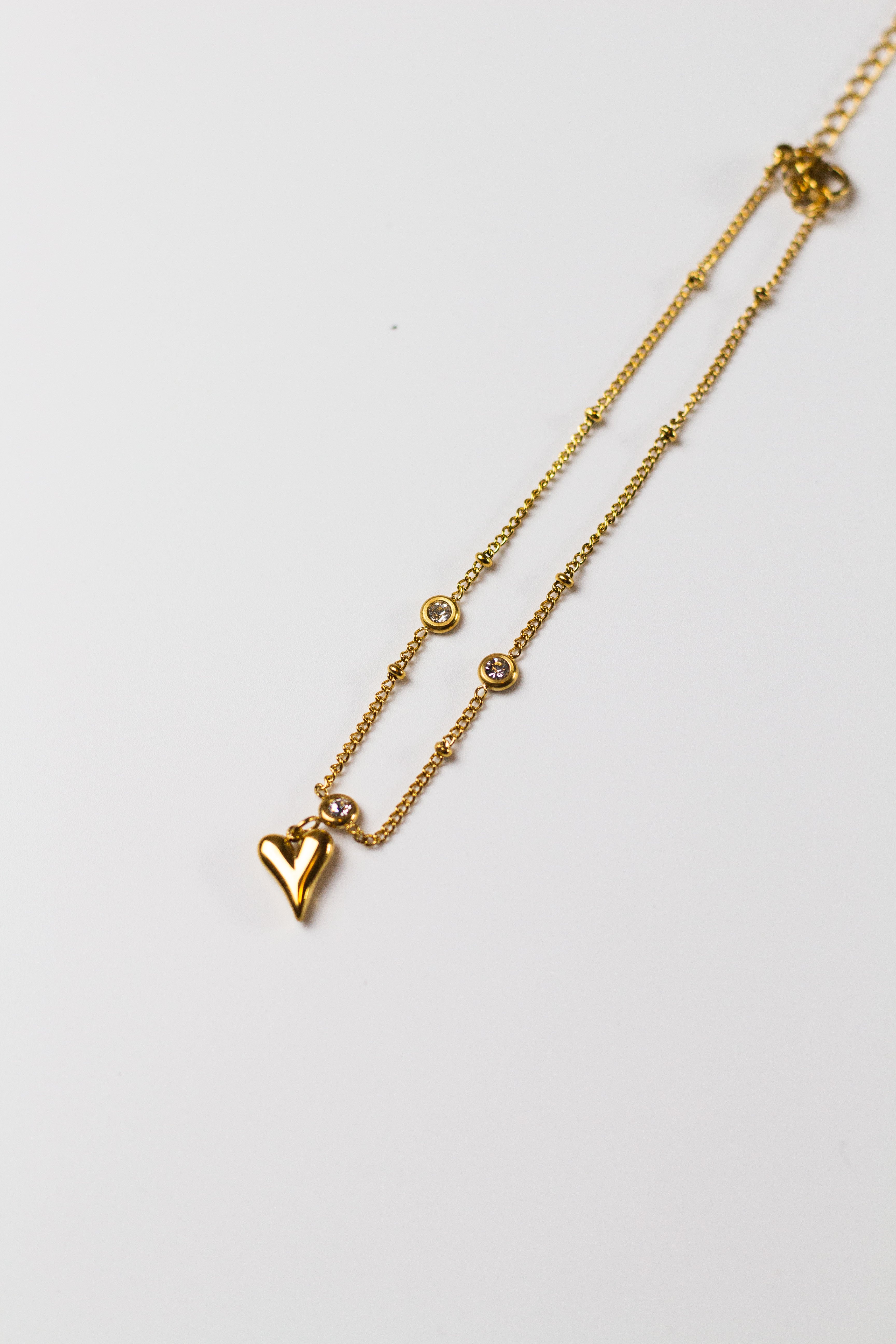 18k gold anklet with a heart shaped charm. Ella's Element Heart Charm Anklet by E's Element.