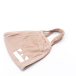 Beige Pink Face Mask by E's Element. Imprinted on the bottom left of the face mask is the E's Element logo in white.