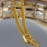 18k gold stainless steel buckle chain necklace placed on a mirror. Ella Buckle Chain by E's Element.