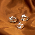 18k silver molten rings placed on an orange cloth.  Ella Lava Ring Trio (Set of 3) by E's Element.