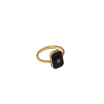 18k gold ring. The ring has zircon stone in the middle of a rectangular black surface. Infinity Zircon Ring by E's Element.