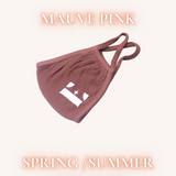 Mauve pink face mask with the E's Element logo imprinted in white. Above the mask is the word "CINNAMON". Below the mask are the words, "SPRING/SUMMER APPROVED". Reusable Masks (5 Piece) by E's Element.