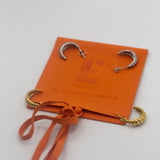 18k silver and gold earrings resting on an orange microfiber leather pouch. Microfiber Jewelry Pouch by E's Element.